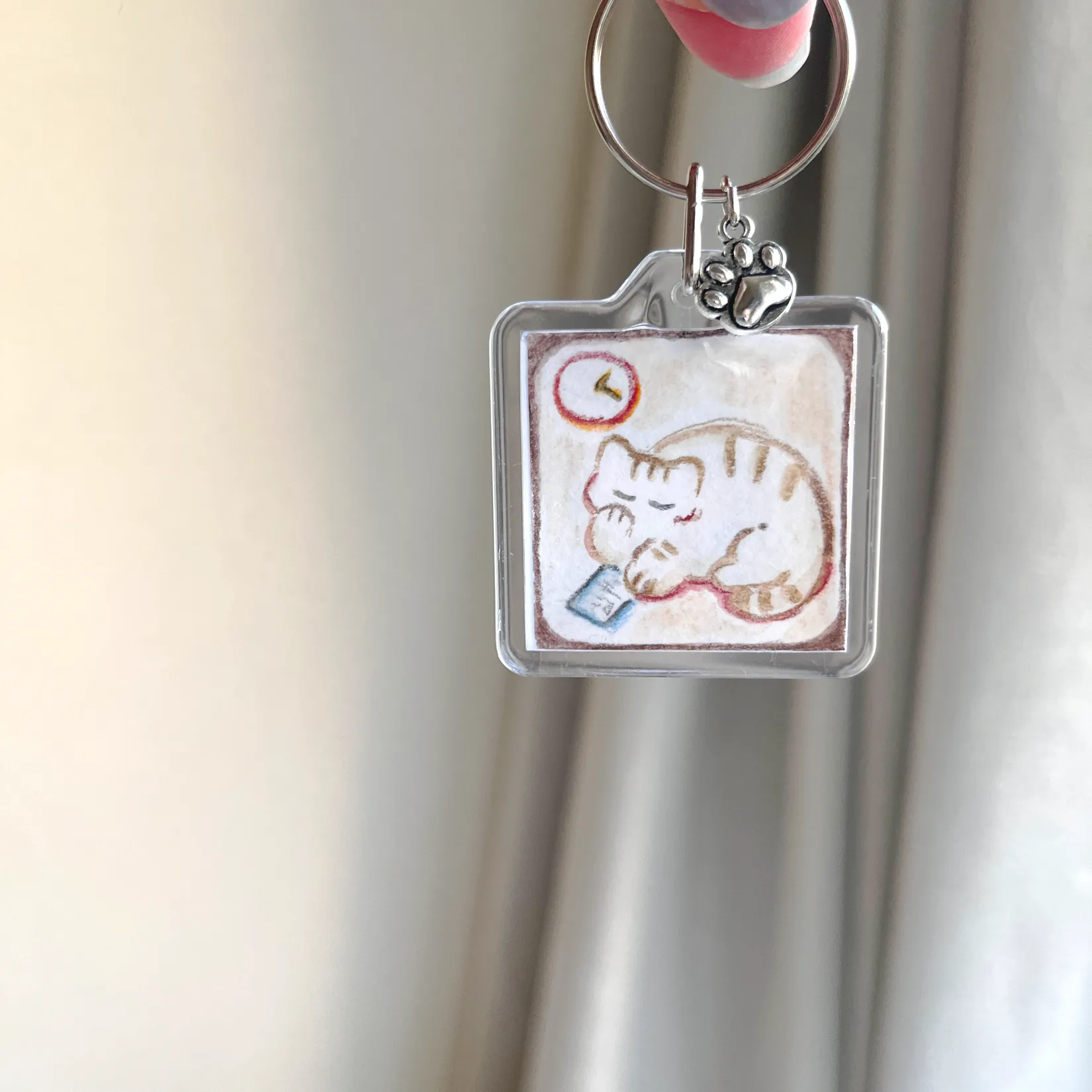 ねむいのにSNSみちゃうねこ